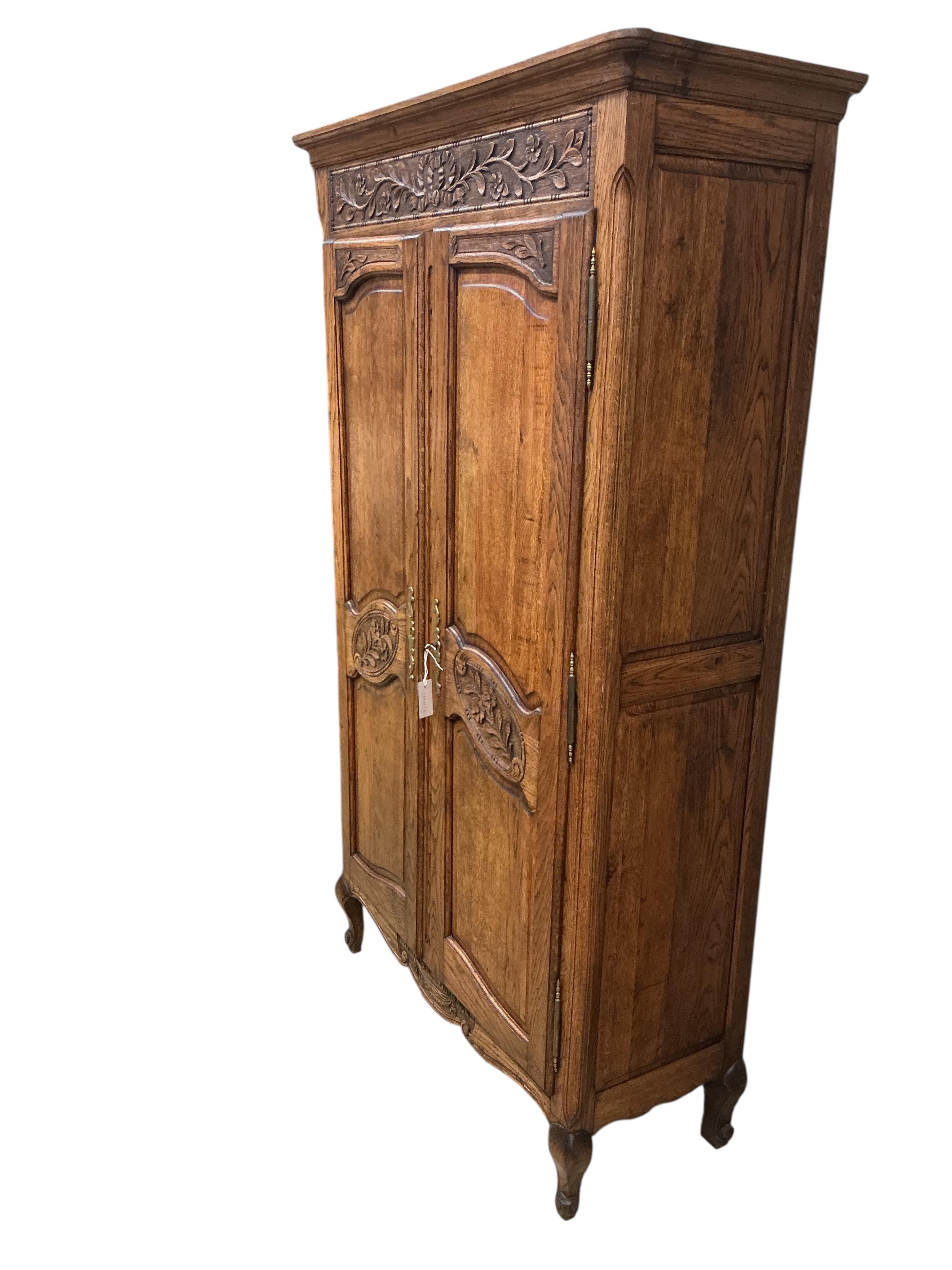 A small 18th century style French oak armoire, width 108cm, depth 45cm, height 189cm